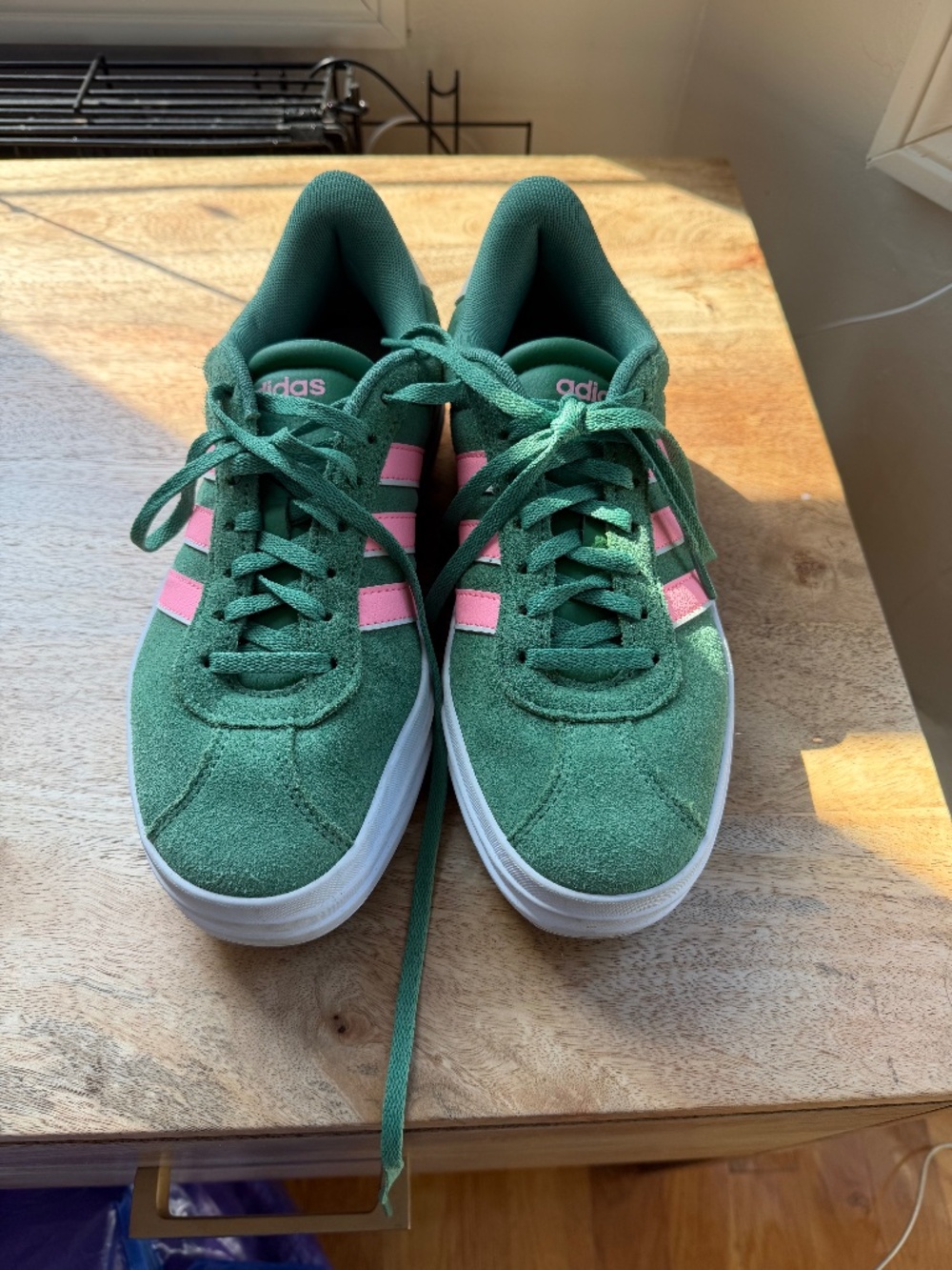 Green and Pink Adidas sneakers